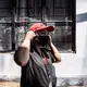 Lady adjusts her makeshift mask before going to her next appointment. Image by Xyza Bacani. Philippines, 2020.