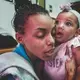 Betania hugging her daughter on a visitor day at a Caracas detention center. She received humanitarian aid that enabled her to breastfeed her child once a day. Image by Ana María Arévalo. Venezuela, 2017.