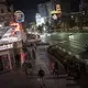 People walk along the Las Vegas Strip, Monday, Nov. 9, 2020. Things have gotten better in Las Vegas since casinos were allowed to reopen in June, following the springtime shutdowns to avoid the spread of the coronavirus. But the number of visitors is still just half of what it was a year ago.&nbsp;Image by Wong Maye-E / AP Photo. United States, 2020.