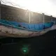 A wooden boat carrying the remains of migrant belongings is seen at the Arinaga port in Gran Canaria island, on Wednesday, Aug. 19, 2020.&nbsp;Image by Emilio Morenatti/AP Photo. Spain, 2020.