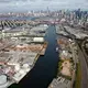 Newtown Creek, a 5.5 kilometer-long tributary of New York’s East River, is one of the most heavily industrialized and polluted sites in the United States. Water overflowed the armored banks of the waterway during Hurricane Sandy, spreading untreated sewage and toxic chemicals into city streets and basements. The Newtown Creek Wastewater Treatment Plant (the silver egg-shaped tanks on the far left), the largest of New York’s 14 sewage processing facilities, was responsible for the sewage—it released 550 million liters after becoming submerged. Image by Alex MacLean. United States, 2019.