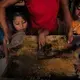 At Paso a Paso School in San Antonio Aguas Calientes, the kids make lunch with a stove made by the Ecocomal company, whose co-founder, Ana Luisa Herrera, also started the school. Safe, smokeless cook stoves promote education—because they help protect children’s health. Image by Lynn Johnson. Guatemala, 2017.