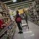 Norma Flores, 54, shops for snacks for her grandchildren at a store near her home in Henderson, Nevada, Tuesday, Nov. 10, 2020.&nbsp;Image by Wong Maye-E / AP Photo. United States, 2020.