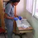 A nurse at the IHI offices prepares instuments for a breast biopsy.&nbsp;Image by Kate Corrigan. Haiti, 2017. 