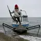 Vebjørn Aishana Reitan, polar bear guide and certified U.S. Coast Guard captain, dismounting his boat. Image by Nick Mott. United States, 2019.