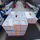 Workers stack boxes of yogurt at TH Milk's operations in Nghia Son, Vietnam. Image by Mark Hoffman. Vietnam, 2019. 