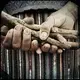 San Lorenzo: These are the hands of Juana Juarez Agustine, 63, holding wood that will be used to light a traditional chuj or sauna. Image by Lynn Johnson. Guatemala, 2017.