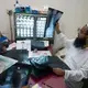 Dr. Ferdous Wahid, right, examines a chest x-ray. “This makes me alarmed,” one Dhaka resident said of the city’s pollution, “thinking how much of the dust is settling in my lungs.” Image by Larry C. Price. Bangladesh, 2018.