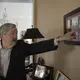 U.S. Ambassador to China Terry Branstad points to a photo taken during a 1985 visit to the Iowa State Capitol by Xi Jinping, China's current president. The photograph hangs inside the entry of his residence Sunday, September 24, 2017, in Beijing, China. Image by Kelsey Kremer. China, 2017.
