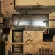 This Feb. 13, 2018, photo shows damage and bullet holes from the country’s civil war outside a women’s hair salon in Aden, Yemen. The mood is eerie on the mostly empty streets of Aden, Yemen’s southern port city and erstwhile seat of government that has suffered three years of civil war. Image by Nariman El-Mofty. Yemen, 2018. </p>
<p>