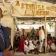 Children photograph the Sunday service in the main sanctuary of the Church of the Nazarene, which doubles as a private elementary school, in the Onaville neighborhood. Founder and pastor Marc Loumette has expanded the school slowly over the years to its current enrollment of 250 students. A foundation has been laid for a much bigger, two-story complex, for which Loumette has already drawn up plans and the congregation has been saving. Image by Allison Shelley. Haiti, 2019.