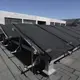 Solar panels on the roof of the new General Hospital have been damaged by bullets from protests. The sprawling new hospital campus was one of the first projects approved for Haiti’s reconstruction following the earthquake of Jan. 12, 2010. Image by Jose A. Iglesias. Haiti, 2019.