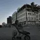 In this Feb. 13, 2018, photo, a elderly man walks past a damaged building from the 2015 war in Aden, Yemen. Violence, famine and disease have ravished the country of some 28 million, which was already the Arab world’s poorest before the conflict began. Image by Nariman El-Mofty. Yemen, 2018. </p>
<p>