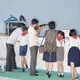 Families enjoy National Liberation Day (August 15th) at the Rungna Dolphinarium. Image by Max Pinckers/The New Yorker. North Korea, 2017.