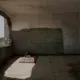 This Feb. 9, 2018, photo shows damage inside a classroom of a school that turned into a camp for displaced persons in Khanfar, Abyan, Yemen. Because of the country’s civil war, damaged buildings are hollowed-out versions of their former selves, a testament to past lives and aspirations of inhabitants who now scrape by on aid handouts and the bare minimum for survival. Image by Nariman El-Mofty. Yemen, 2018.</p>
<p>