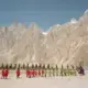 All-girl teams from surrounding villages walk onto the field during the soccer tournament. Image by Sara Hylton/National Geographic. Pakistan, 2019.