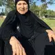 Fawziya Ali, Zahra Ahmad's grandmother, poses for a photo at a park in Baghdad, Iraq. Image courtesy of Ahmad family.